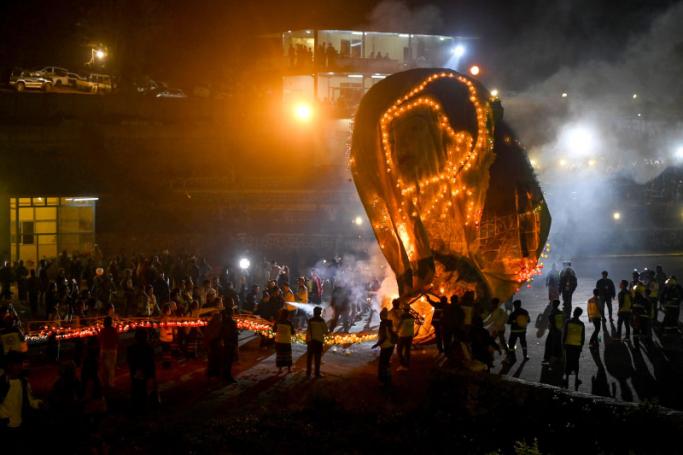 This photo taken on November 7, 2022 shows firefighters at work after a fireworks-laden hot-air balloon ignited before the balloon was at a sufficient height during the Tazaungdaing Lighting Festival at Pyin Oo Lwin Township in Mandalay. Photo: AFP