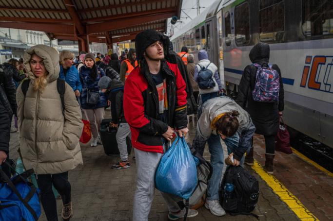 Ukrainian refugees board a train en route to Warsaw at the rail station in Przemysl, near the Polish-Ukrainian border, on March 31, 2022, following Russia's military invasion launched on Ukraine. Photo: AFP