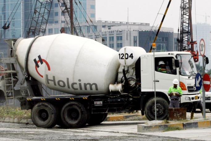 Employees of Holcim Indonesia, a unit of Swiss cement giant Holcim Ltd, work at the factory in Jakarta. Photo: AFP