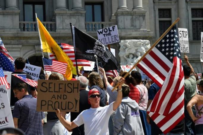 Demonstrators protest in Harrisburg, Pennsylvania, on May 15, 2020, demanding the re-opening of the state (AFP Photo/Nicholas Kamm) 