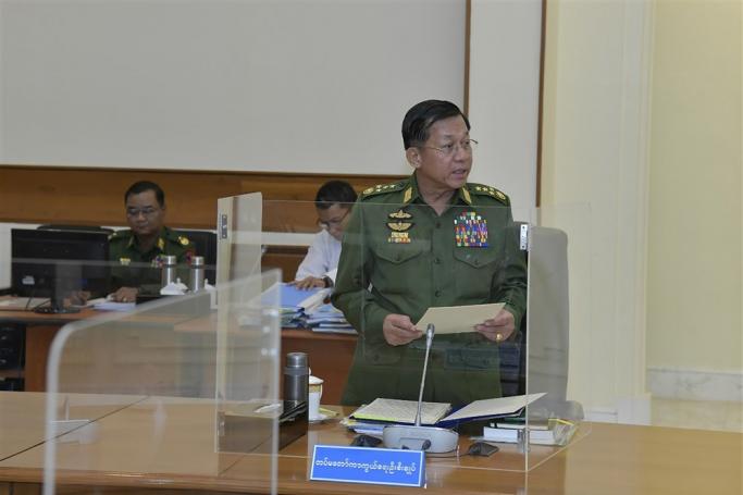 A handout photo made available by the Myanmar military information team shows Myanmar military chief and chairman of the State Administration Council, senior general Min Aung Hlaing (C) speaking to Myanmar acting president Myint Swe (not in picture) attending the National Defence and Security Council (NDSC) meeting in Naypyitaw, Myanmar, 31 January 2023. EPA-EFE/MILITARY INFORMATION TEAM