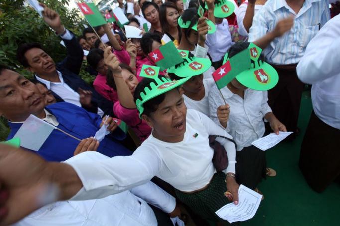 Party members shout slogans during the opening ceremony of a Union Solidarity and Development Party (USDP) office in Mandalay, Myanmar, 20 August 2010. Photo: Nyein Chan Naing/EPA
