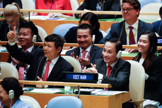Vietnamese Deputy Minister of Foreign Affairs Le Hoai Trung (R) reacts after a vote in the United Nations General Assembly on the election of five non-permanent members of the Security Council at the United Nations headquarters in New York, USA, 07 June 2019. Vietnam is among the five countries elected to the United Nations Security Council. Photo: Jason Szenes/EPA-EFE