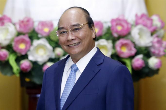 (FILE) - Vietnamese President Nguyen Xuan Phuc smiles at the Presidential Palace in Hanoi, Vietnam, 27 June 2022 (reissued 17 January 2023). Photo: EPA