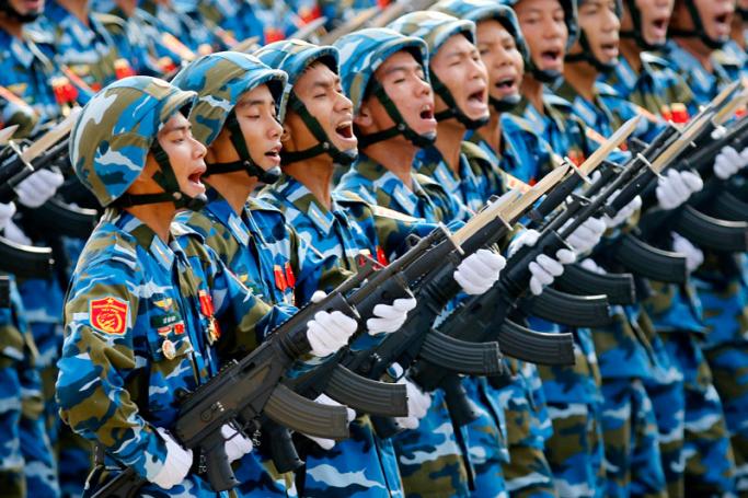 Vietnamese soldiers of an army defense unit march during a parade marking 70th anniversary of National Day at a street in Hanoi, Vietnam. Photo: Minh Hoang/EPA