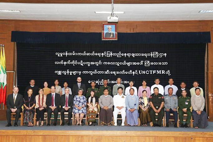 Union Minister Dr Win Myat Aye, officials from UN Country Task Force on Monitoring and Reporting and officials pose for a group photo at the coordination meeting in Nay Pyi Taw yesterday. Photo:MNA