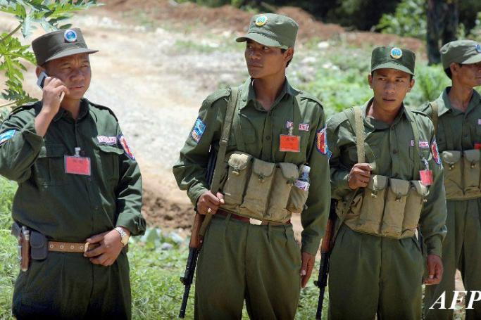 Members of the ethnic Wa Army stand guard in Pangsan, north of Kyaing Tong, Myanmar. Photo: Khin Maung Win/AFP
