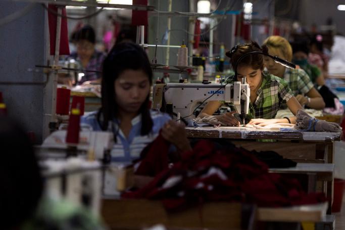  Labours work at a garment factory in Yangon. Photo: Ye Aung Thu/AFP
