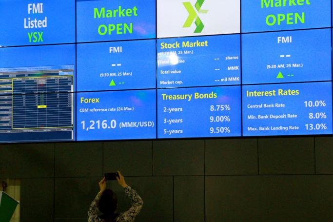 An electronic board showing the FMI (First Myanmar Investment) index at Yangon Stock Exchange in Yangon on 25 March 2016. Photo: Hlaing Myo Htun/Mizzima
