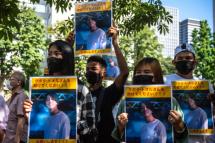 A group of activists hold placards of Japanese citizen Toru Kubota, who is detained in Myanmar, during a rally in front of the Ministry of Foreign Affairs in Tokyo on July 31, 2022. Photo: AFP