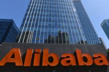 An Alibaba sign is seen outside the company's office in Beijing on April 13, 2021. GREG BAKER / AFP