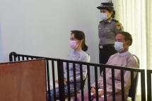 Civilian leader Aung San Suu Kyi (L) and detained president Win Myint (R) during their first court appearance in Naypyidaw, since the military detained them in a coup. Photo: AFP