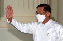 This handout photo taken and released by National Television of Cambodia (TVK) shows Myanmar military chief Min Aung Hlaing waving. Photo: AFP