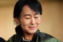 Chairperson of The National League for Democracy of Myanmar, Aung San Suu Kyi smiles as she pays tribute at Rajghat,The Memorial to Mahatma Gandhi in New Delhi on November 14, 2012. Suu Kyi is in India for a seven-day visit.  Photo: AFP