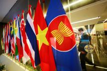 A man walks past flags of Association of Southeast Asian Nations (ASEAN) and member nations at the Suntec International Convention and Exhibition Centre, the venue of the 33rd Association of Southeast Asian Nations (ASEAN) Summit and Related meetings in Singapore, 10 November 2018. Photo: How Hwee Young/EPA