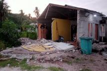 This handout picture taken and released on January 10, 2023 by BNPB (National Disaster Management Agency) shows a damaged house after a 7.6-magnitude earthquake hit deep under the ocean off Indonesia and East Timor, in the Tanimbar islands in Maluku. (Photo by Handout / BNPB / AFP)