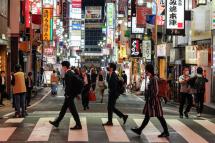 Pedestrians walk past Kabukicho at Shinjuku in Tokyo, Japan. Photo: EPA