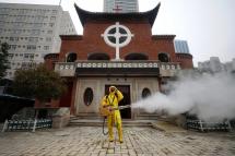 A volunteer disinfects a Christian church in Wuhan, Hubei province, China, 06 March 2020. Photo: EPA
