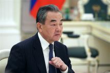 China's Director of the Office of the Central Foreign Affairs Commission Wang Yi listens to Russian President Putin during their meeting in the Kremlin, in Moscow, Russia, 22 February 2023. Photo: EPA