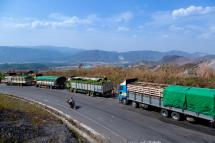 Food trucks wait to enter China near Muse, close to the Chinese border in Shan state, on April 20, 2020, after China reduced the number of food trucks allowed to enter per day as a result of the COVID-19 novel coronavirus. Photo: Phyo Maung Maung/AFP