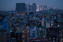 Residential and high rise commercial buildings are seen early evening in Yangon . Photo: Ye Aung Thu/AFP