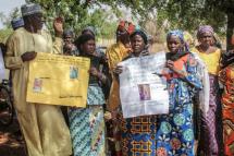 Parents and relatives hold pictures of girls missing since they were abducted by Boko Haram on April 14, 2014 in Chibok, northern Nigeria (AFP Photo/Audu Ali MARTE) 