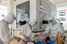Medical staff prepare materials for COVID-19 coronavirus test at a quarantine facility in Hlaing University in Yangon. Photo: Ye Aung Thu/AFP