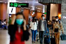 People wear masks at the departure lounge at the Yangon International Airport in Yangon, Myanmar. Photo: Nyein Chan Naing/EPA