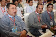 Myanmar Chairman of property group Zaykabar Company Khin Shwe (L), and CEO of Ruby Dragon Jade & Gems Company Ltd Ne Win Tun (C), attend a business conference hosted by Myanmar State Counsellor and Foreign Minister Aung San Suu Kyi in capital city of Naypyidaw. Photo: AFP