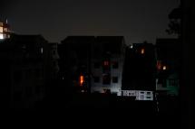 A view of buildings during a power outage at a residential area of Yangon, Myanmar, 14 January 2022. Photo: EPA