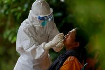 A person takes a COVID-19 test at a community quarantine center in Yangon, Myanmar, 07 October 2020. Photo: Lynn Bo Bo/EPA