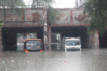 A public transport bus and a truck seen stuck in a Prahladpur water-logged underpass after heavy monsoon rain in New Delhi, India, 19 August 2020. Photo: EPA