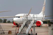 (File) A Myanmar National Airlines (MNA) aircraft parked on the tarmac as commercial flights remain temporarily suspended as part of the measures to control the spread of the COVID-19 coronavirus disease, at Yangon International Airport in Yangon, Myanmar, 10 May 2020. Photo: Nyein Chan Naing/EPA