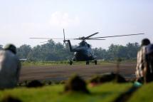 A Myanmar military transport helicopter prepares to take off at the Sittwe airport, Rakhine State. Photo: Nyunt Win/EPA
