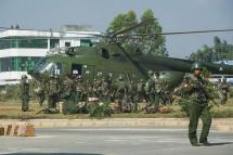 File) Myanmar government troops board a military helicopter in Muse located in Shan State of Myanmar. Photo: AFP