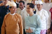 (File) Myanmar's President Win Myint (L) and State Counsellor Aung San Suu Kyi (R) arrive at the parliament in Naypyidaw to take his oath of office on March 30, 2018. Photo: AFP
