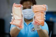 Regional narcotitcs problem - A Bureau of Customs examiner shows amphetamine that were found hidden inside parcels at the Bureau of Customs office in Manila, Philippines, 14 September 2016. Photo: EPA
