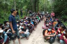 In this handout photo from the Royal Thai Army released on October 25, 2021, Myanmar migrants are pictured after being apprehended by the Thai military personnel in Kanchanaburi province, bordering Myanmar. Photo: ROYAL THAI ARMY / AFP