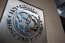 The logo of the International Monetary Fund (IMF) at the entrance of the Headquarters of the IMF. Photo: EPA