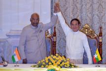 Myanmar's President Win Myint (R) and Indian President Shri Ram Nath Kovind (L) hold hands up after the signing of a Memorandum of Understanding (MOU) at the Presidential Palace in Naypyitaw, Myanmar, 11 December 2018. Photo: Thet Aung/EPA/POOL