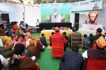 People listen as Indian Prime Minister Narendra Modi delivers a virtual address to the farmers of six states on the occasion of birth anniversary of former Indian prime Minister Atal Bihari Vajpayee, in New Delhi, India, 25 December 2020. Photo: EPA