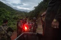 In this photograph taken October 11, 2016, rebels belonging to the Kachin Independence Army (KIA) ethnic group move towards the frontline near Laiza in Kachin state. Hkun Lat/AFP
