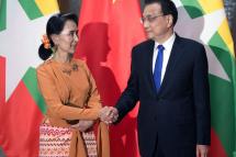 Myanmar State Counsellor Aung San Suu Kyi (L) shakes hands with Chinese Premier Li Keqiang (R) at the Great Halll of the People in Beijing, China, 16 May 2017. Photo: EPA