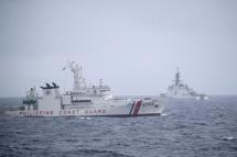 (File) Philippine Coast Guard BRP Melchora Aquino (PCG-BRP 9702) patrol ship (L) and United States Coastguard Cutter (USCGC) Midgett (WMSL-757) (R) maneuver during a maritime drill in the disputed South China Sea, Philippines, 03 September 2022. Photo: EPA