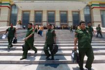 Military representatives leave after the second regular session of the the Pyithu Hluttaw (lower house parliament) in Naypyitaw, Myanmar, Myanmar. Photo: Hein Htet/EPA