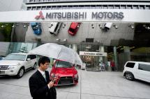 Mitsubishi Motor Corp. cars on display in front of the company's global headquarters in Tokyo, Japan. Photo: EPA