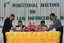 Union Minister Lt-Gen Kyaw Swe and Gen. To Lam sign the bilateral agreement at the 3rd Ministerial Meeting on Security and Law Enforcement Matters in Nay Pyi Taw yesterday. Photo: MNA