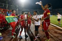 Myanmar football team celebrate after they win the match with Malaysia team during the AFF Suzuki Cup Group B soccer match in Thuwanna Football statdium in Yangon, Myanmar, 26 November 2016. Photo: Nyein Chan Naing/EPA

