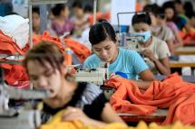 Myanmar girls work in a garment factory at Hlaing Thar Yar Industrial Zone in Yangon. Photo: Lynn Bo Bo/EPA
