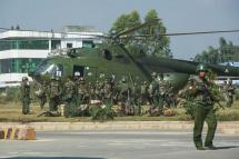 (File) Myanmar government troops board a military helicopter in Muse located in Shan State of Myanmar near China's border in 2016. Photo: Ko Sai/AFP